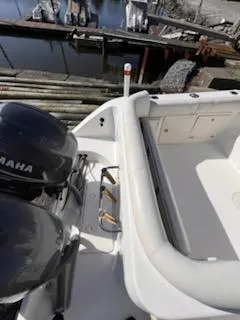 Slide: The Image of 2008 Century 2400 Walkaround boat with Yamaha engines, docked near wooden pier. - 19