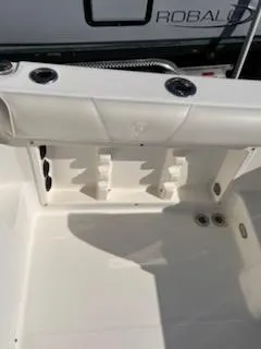 Slide: The Image of 2008 Century 2400 Walkaround boat interior with rod holders and storage compartments. - 9