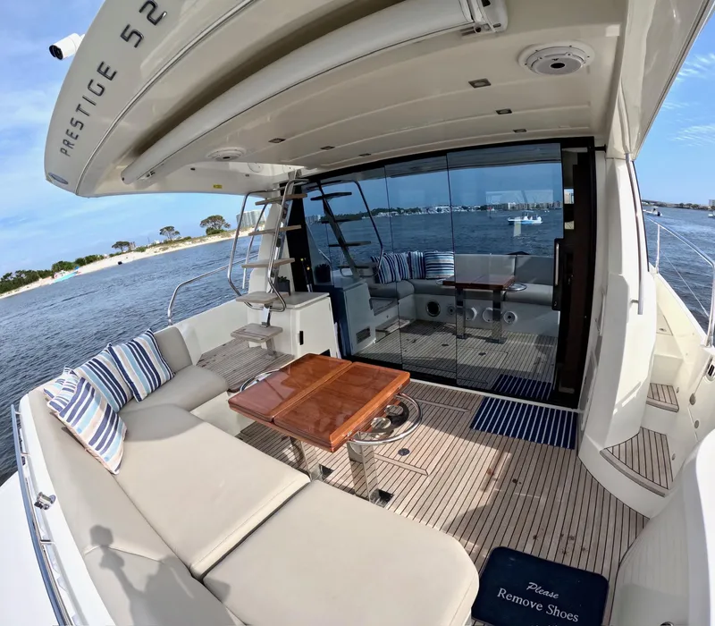 Slide: The Image of Luxurious 2019 Prestige 520 yacht with spacious deck and elegant seating area. - 10