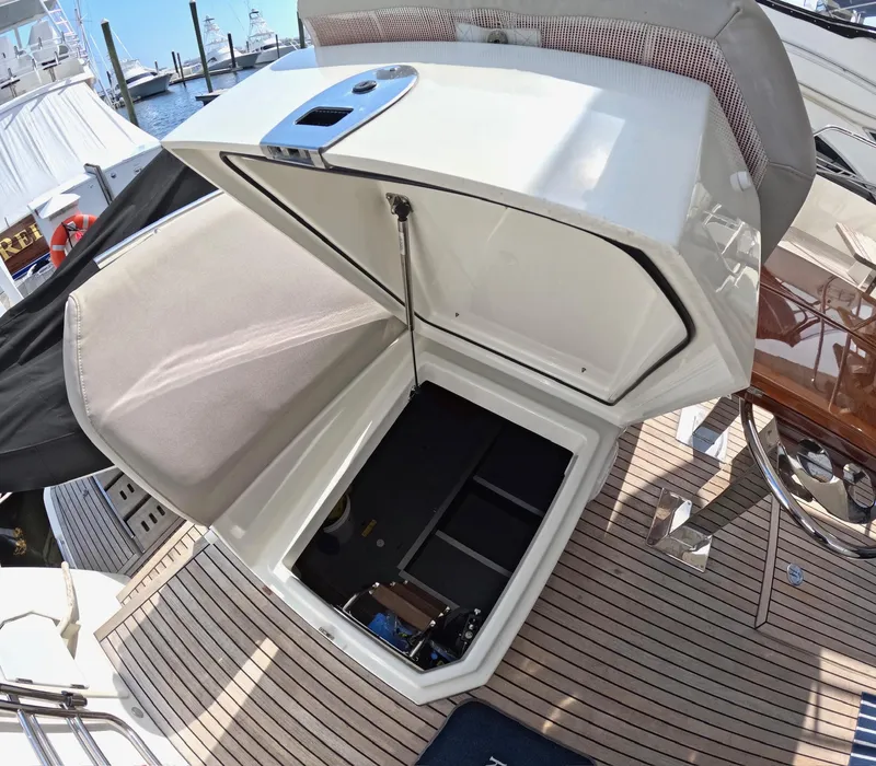 Slide: The Image of Open storage compartment on 2019 Prestige 520 yacht deck, showcasing spacious interior. - 12