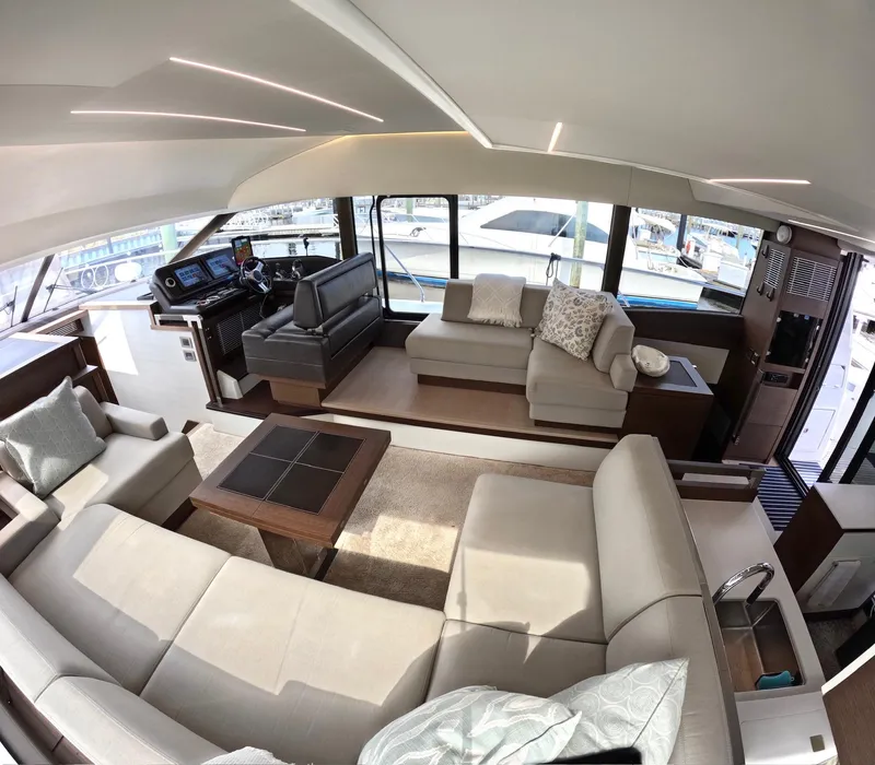 Slide: The Image of Luxurious interior of a 2019 Prestige 520 yacht with modern seating and helm station. - 18