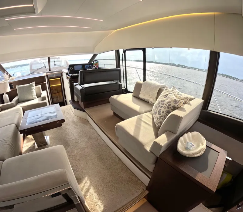 Slide: The Image of Luxurious interior of a 2019 Prestige 520 yacht with elegant seating and panoramic windows. - 19