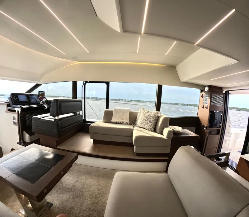 Slide: The Image of Luxurious interior of a 2019 Prestige 520 yacht with modern seating and panoramic windows. - 20