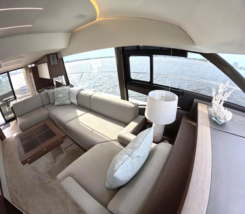 Slide: The Image of Luxurious interior of 2019 Prestige 520 yacht with elegant seating and ocean view. - 22