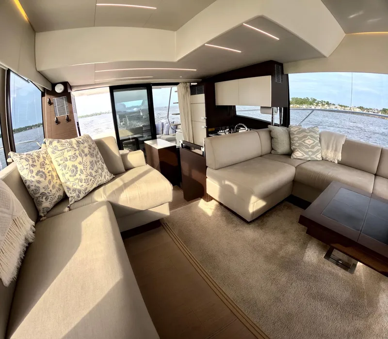 Slide: The Image of Luxurious interior of a 2019 Prestige 520 yacht with elegant seating and panoramic windows. - 23