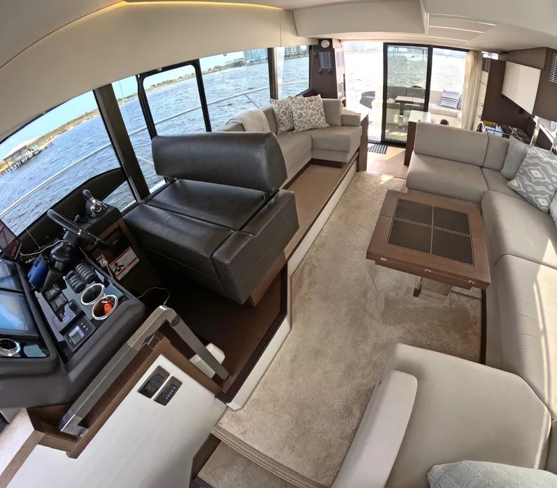 Slide: The Image of Luxurious interior of a 2019 Prestige 520 yacht with elegant seating and panoramic windows. - 24
