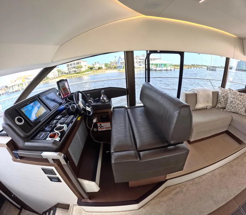 Slide: The Image of Luxurious interior of a 2019 Prestige 520 yacht with modern helm and seating. - 25