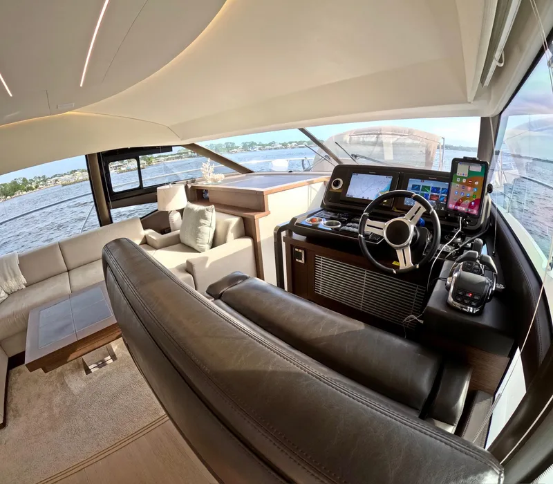 Slide: The Image of Luxurious interior of a 2019 Prestige 520 yacht with modern helm and seating area. - 26