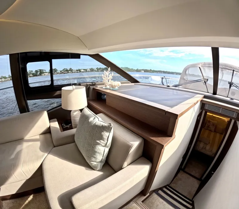 Slide: The Image of Luxurious interior of 2019 Prestige 520 yacht with elegant seating and scenic water view. - 28