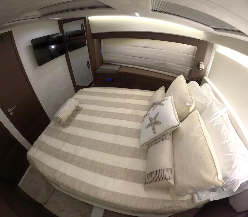 Slide: The Image of Luxurious bedroom interior of 2019 Prestige 520 yacht with elegant bedding and modern decor. - 31