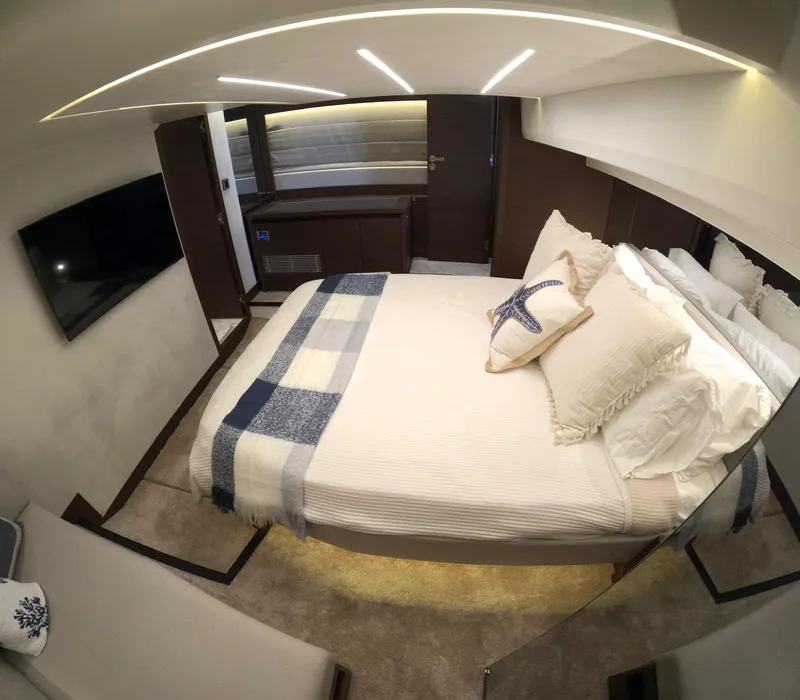 Slide: The Image of Luxurious bedroom interior of 2019 Prestige 520 yacht with modern decor and cozy bedding. - 34