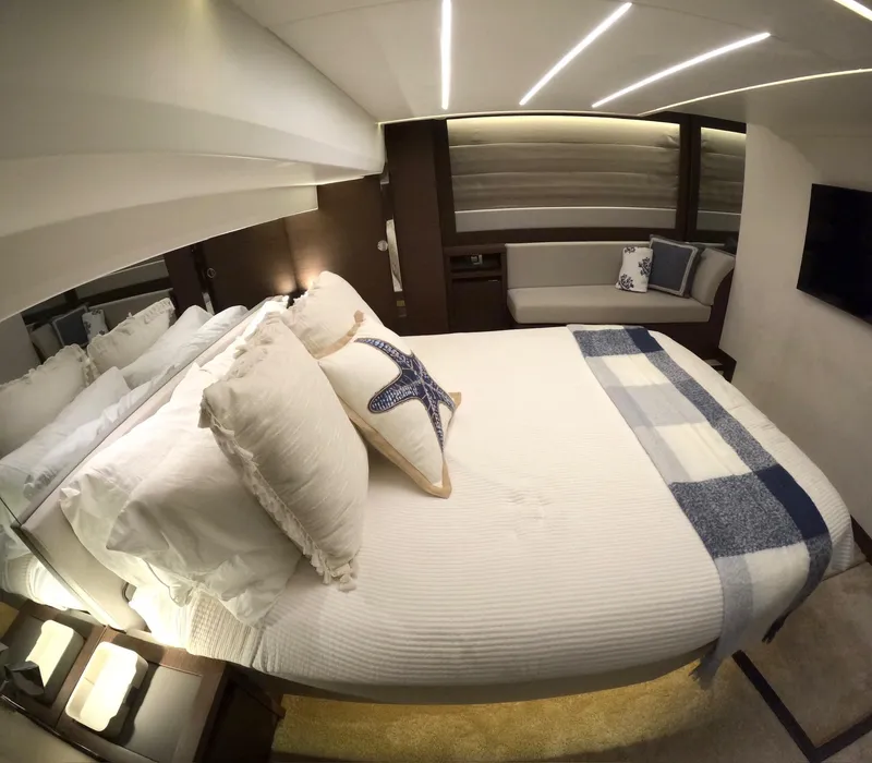 Slide: The Image of Luxurious bedroom interior of 2019 Prestige 520 yacht with elegant bedding and modern lighting. - 35