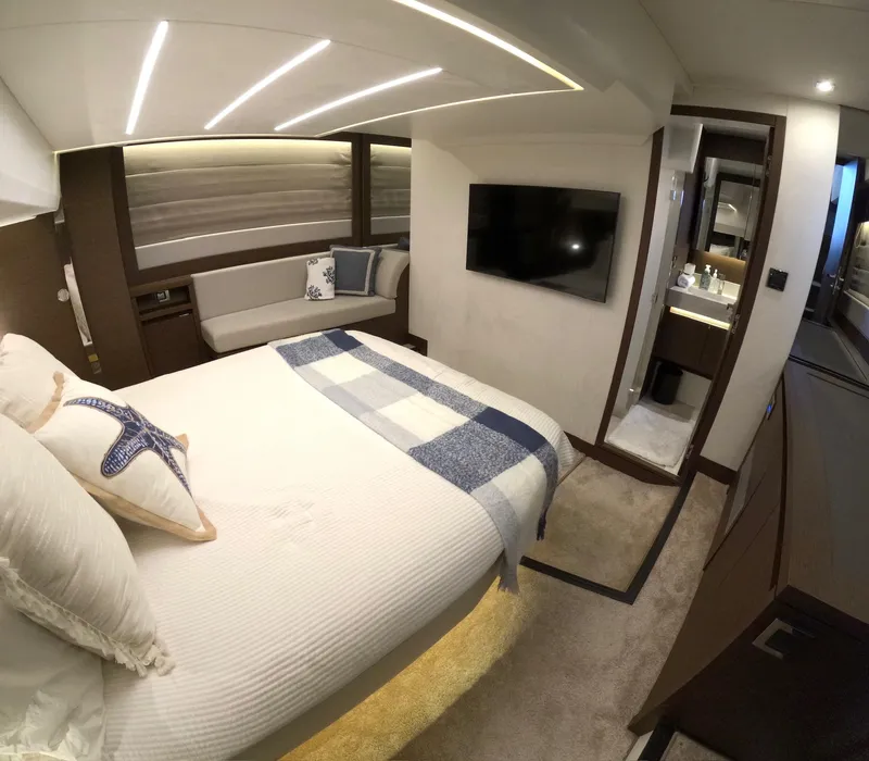 Slide: The Image of Luxurious bedroom interior of 2019 Prestige 520 yacht with modern decor and amenities. - 36