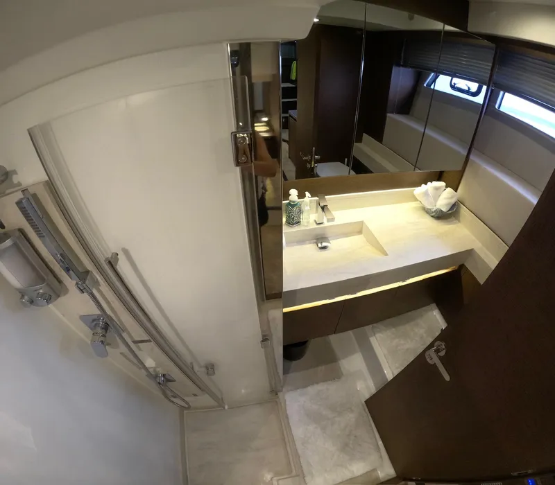 Slide: The Image of Luxurious bathroom interior of 2019 Prestige 520 yacht, featuring modern fixtures and elegant design. - 37