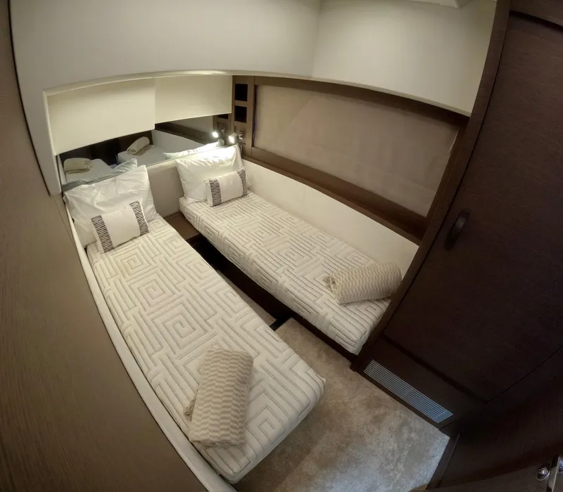 Slide: The Image of Luxurious twin cabin interior of 2019 Prestige 520 yacht, featuring elegant bedding and modern design. - 39