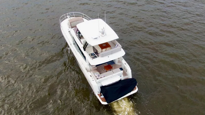 Slide: The Image of Luxury 2019 Prestige 520 yacht cruising on open water. - 6