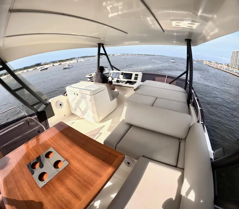 Slide: The Image of Luxurious 2019 Prestige 520 yacht interior with helm, seating, and ocean view. - 8