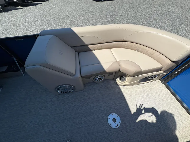 Slide: The Image of 2018 Avalon LSZ Quad Lounger boat interior with beige seating and speaker system. - 11