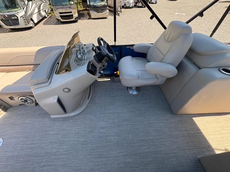 Slide: The Image of 2018 Avalon LSZ Quad Lounger interior with captain's chair and control panel. - 21