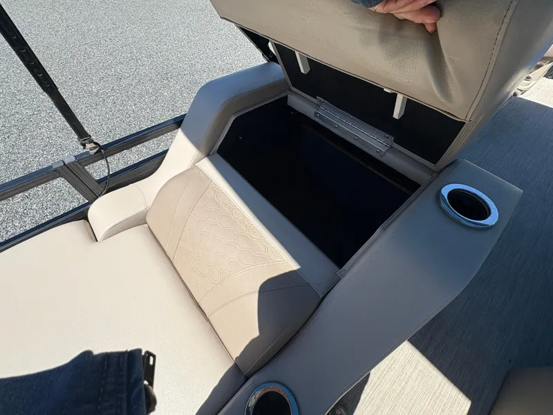 Slide: The Image of 2018 Avalon LSZ Quad Lounger seat storage with cup holders on a boat. - 9