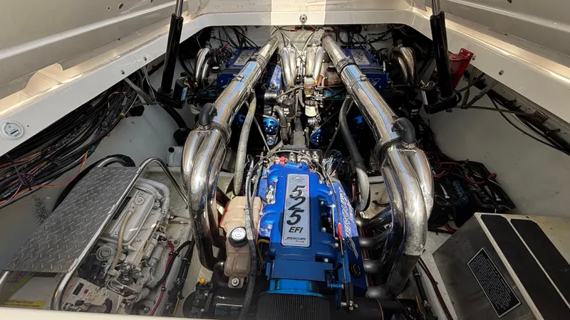 Slide: The Image of Engine compartment of a 2003 Fountain 47 Lightning boat, featuring dual 525 EFI engines. - 13