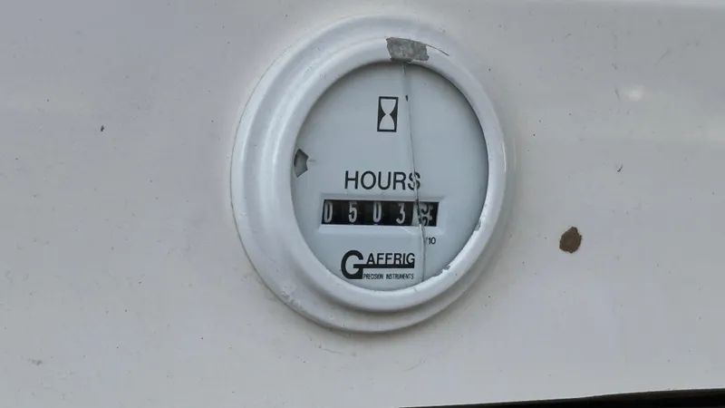 Slide: The Image of Hour meter showing 503.3 hours on a 2003 Fountain 47 Lightning boat. - 14