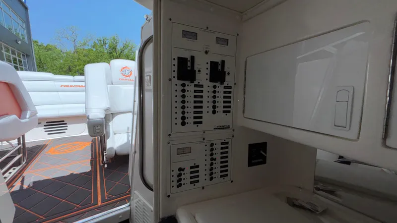 Slide: The Image of Interior view of a 2003 Fountain 47 Lightning boat showing control panels and seating area. - 23