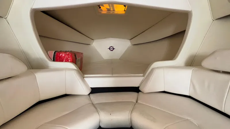 Slide: The Image of 2003 Fountain 47 Lightning boat interior with white seating and storage compartment. - 26