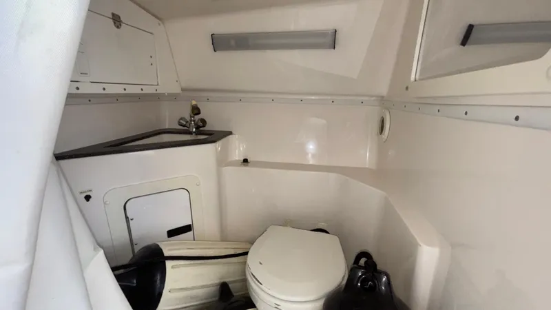 Slide: The Image of 2003 Fountain 47 Lightning boat interior with toilet and sink. - 29