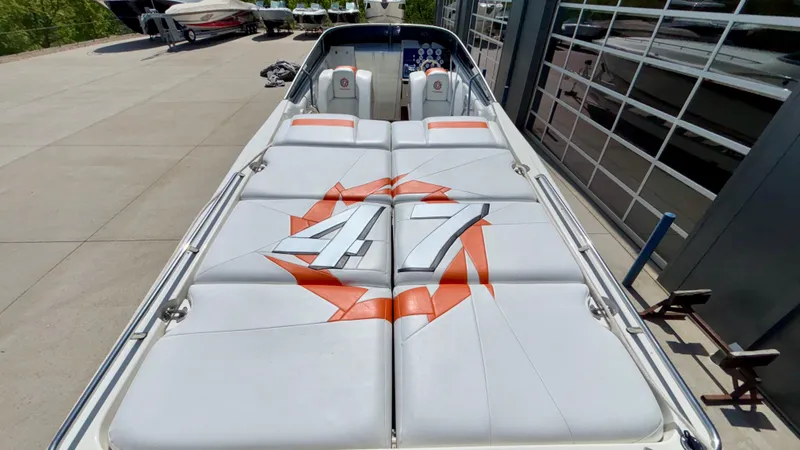 Slide: The Image of 2003 Fountain 47 Lightning boat with sleek design and vibrant orange accents. - 31