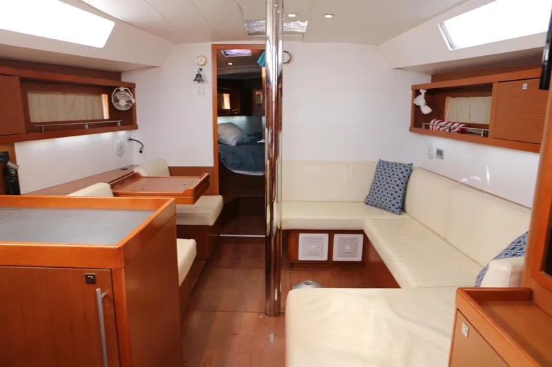 Slide: The Image of Interior of 2014 Beneteau Oceanis 41 yacht with modern seating and wooden finishes. - 22