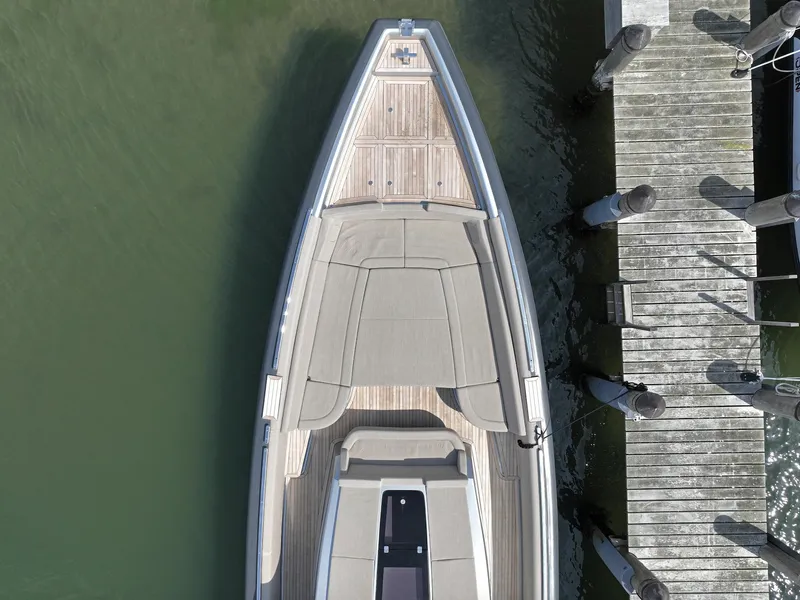 Slide: The Image of Top view of 2023 Novamarine Black Shiver 160 docked beside a wooden pier. - 8