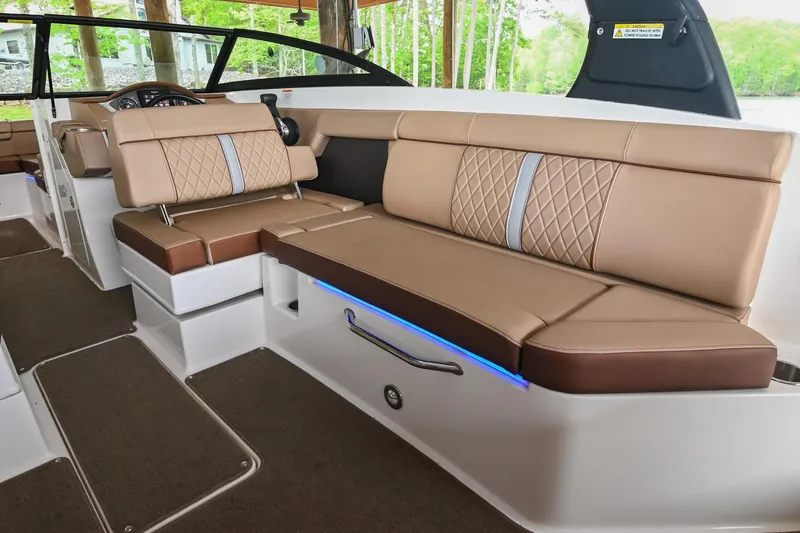 Slide: The Image of 2016 Sea Ray 270 Sundeck interior with beige leather seating and modern design. - 17