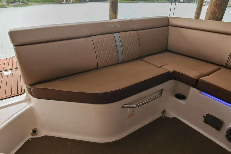 Slide: The Image of 2016 Sea Ray 270 Sundeck interior with tan leather seating and elegant design. - 19