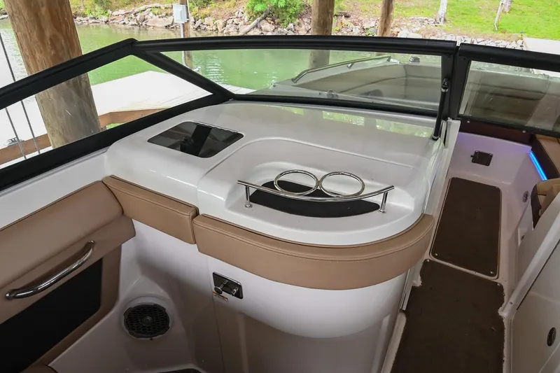 Slide: The Image of 2016 Sea Ray 270 Sundeck interior with cup holders and sleek design. - 25