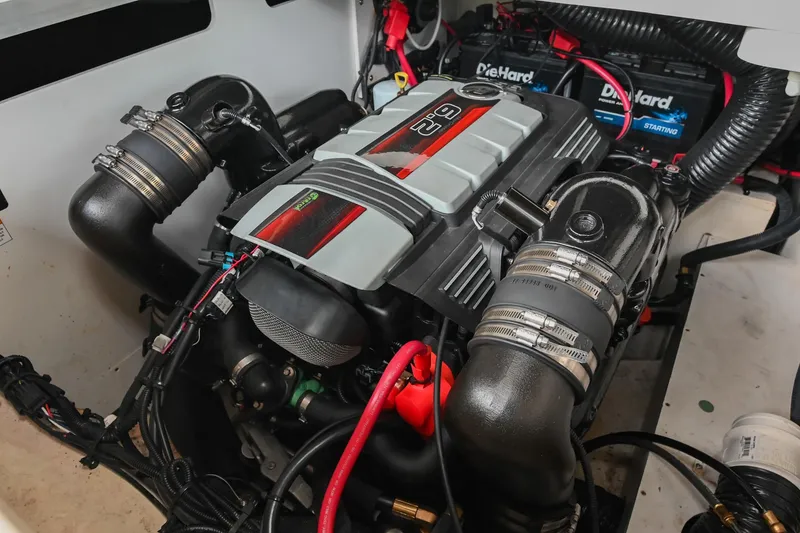 Slide: The Image of 2016 Sea Ray 270 Sundeck engine compartment with powerful motor and DieHard batteries. - 38