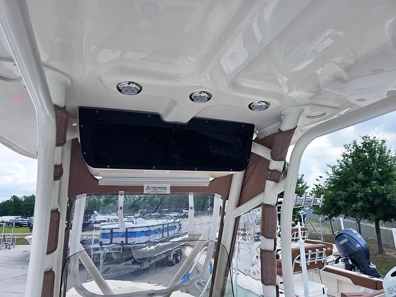 Slide: The Image of 2025 Pioneer 220 Bay Sport boat interior with modern design and overhead lighting. - 14