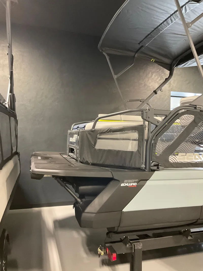 Slide: The Image of 2025 Sea-Doo Switch Cruise Limited 21 pontoon boat in showroom display. - 6