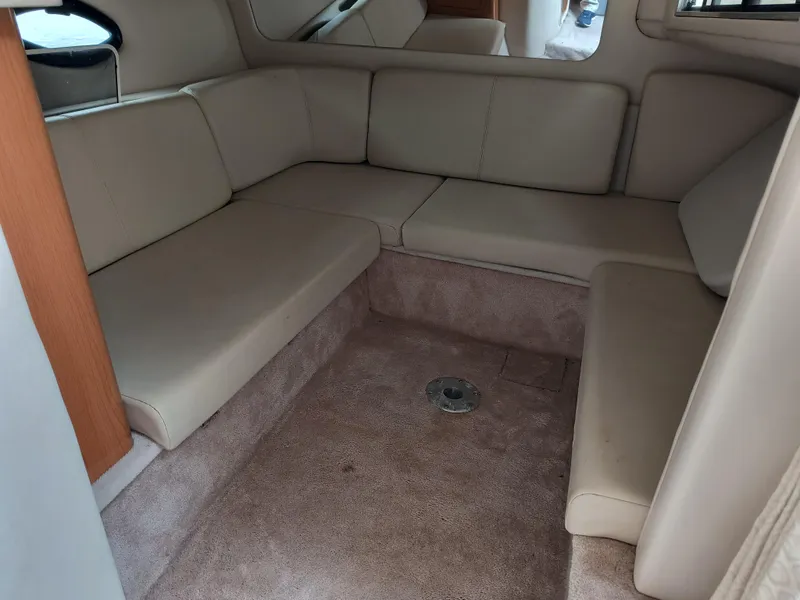 Slide: The Image of 2001 Regal Commodore 3260 interior with beige seating and carpeted flooring. - 11