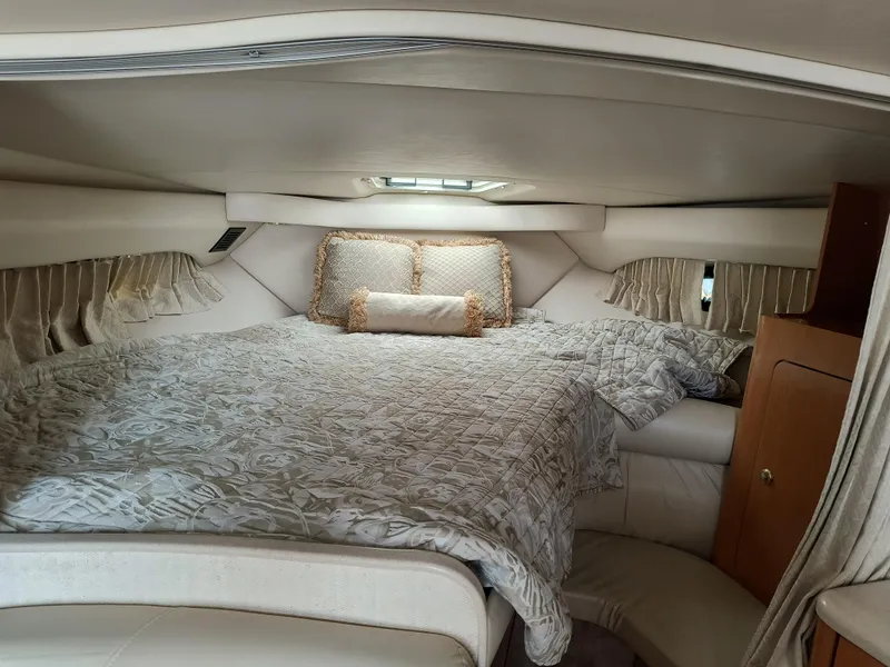 Slide: The Image of Luxurious cabin interior of 2001 Regal Commodore 3260 yacht with cozy bedding. - 16
