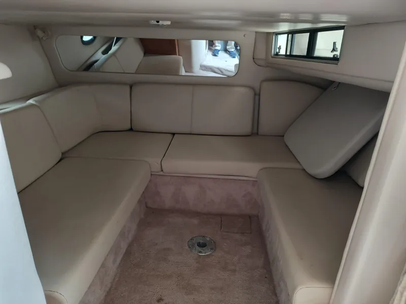 Slide: The Image of Interior cabin of 2001 Regal Commodore 3260 with beige seating and carpet. - 18