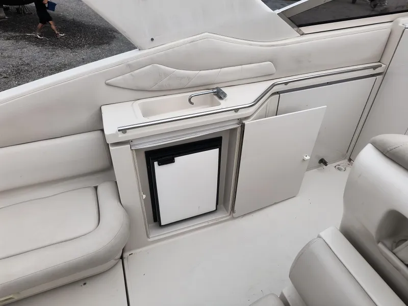 Slide: The Image of 2001 Regal Commodore 3260 boat interior with sink and mini fridge. - 7