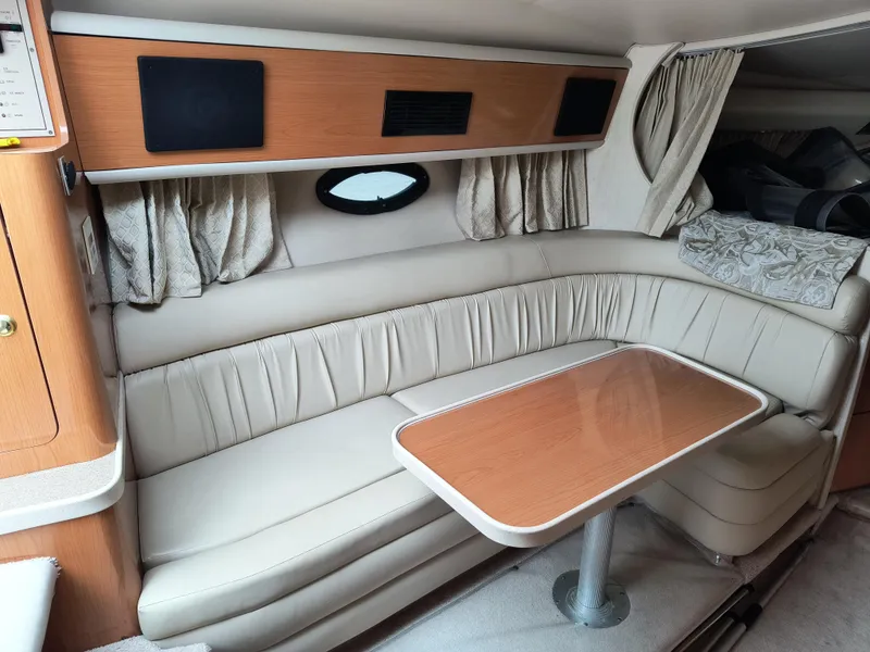 Slide: The Image of 2001 Regal Commodore 3260 interior with beige seating and wooden table. - 9