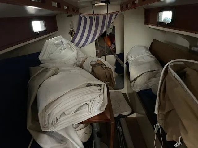 Slide: The Image of Interior of 2003 Herreshoff 42 sailboat with stored sails and nautical decor. - 10