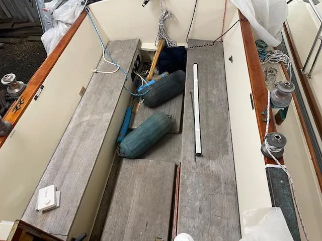 Slide: The Image of Cockpit of 2003 Herreshoff 42 sailboat with wooden benches and nautical equipment. - 4