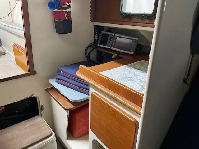 Slide: The Image of Interior of a 2003 Herreshoff 42 sailboat with navigation equipment and storage. - 9