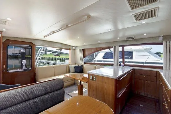 Slide: The Image of Luxurious interior of 2008 Ocean Yachts 46SS with elegant seating and modern kitchen area. - 11