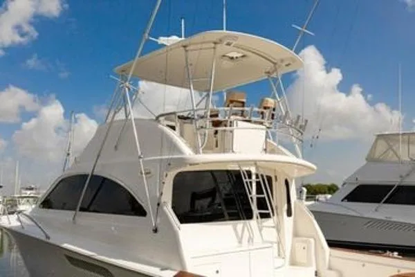 Slide: The Image of 2008 Ocean Yachts 46SS boat docked under a clear blue sky. - 2