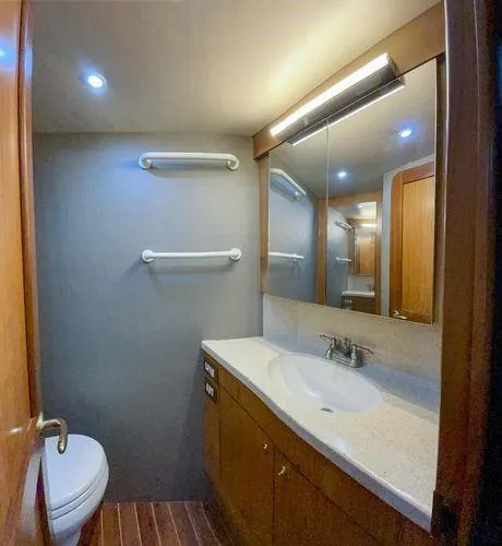 Slide: The Image of Luxurious bathroom in 2008 Ocean Yachts 46SS, featuring modern fixtures and wooden cabinetry. - 21