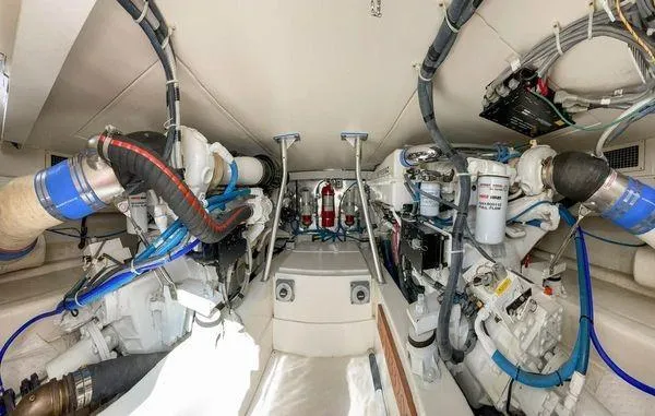 Slide: The Image of Engine room of 2008 Ocean Yachts 46SS, showcasing dual engines and mechanical systems. - 22